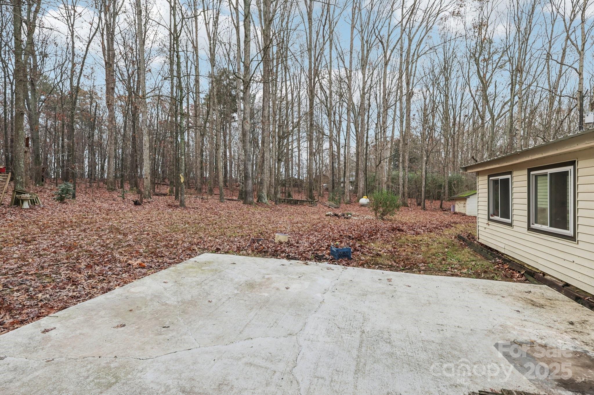 920 Dewitt Helms Road Monroe, NC 28112 - Photo 37 of 47 a view of a backyard with large trees