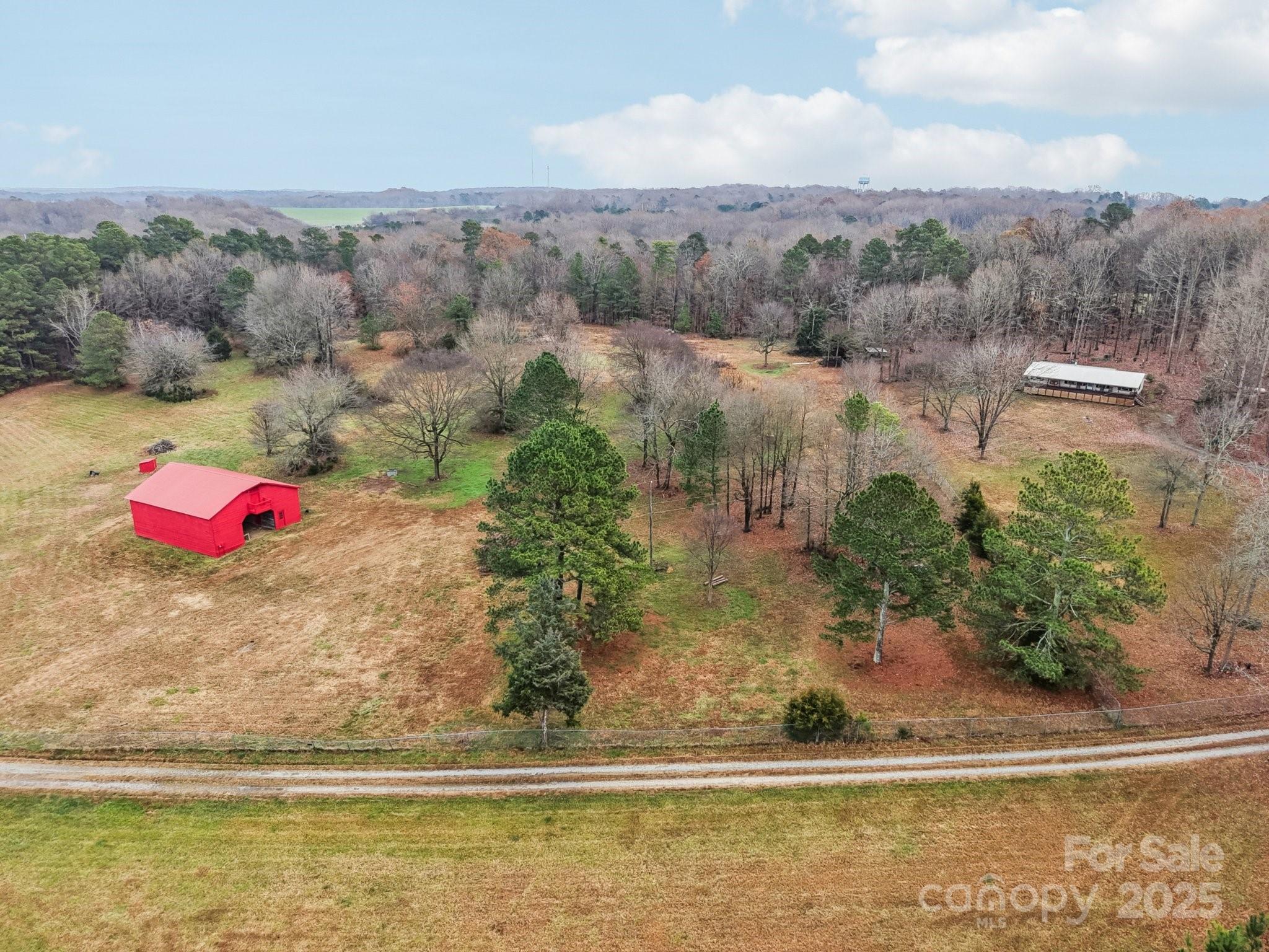 920 Dewitt Helms Road Monroe, NC 28112 - Photo 40 of 47 an aerial view of a houses with a yard