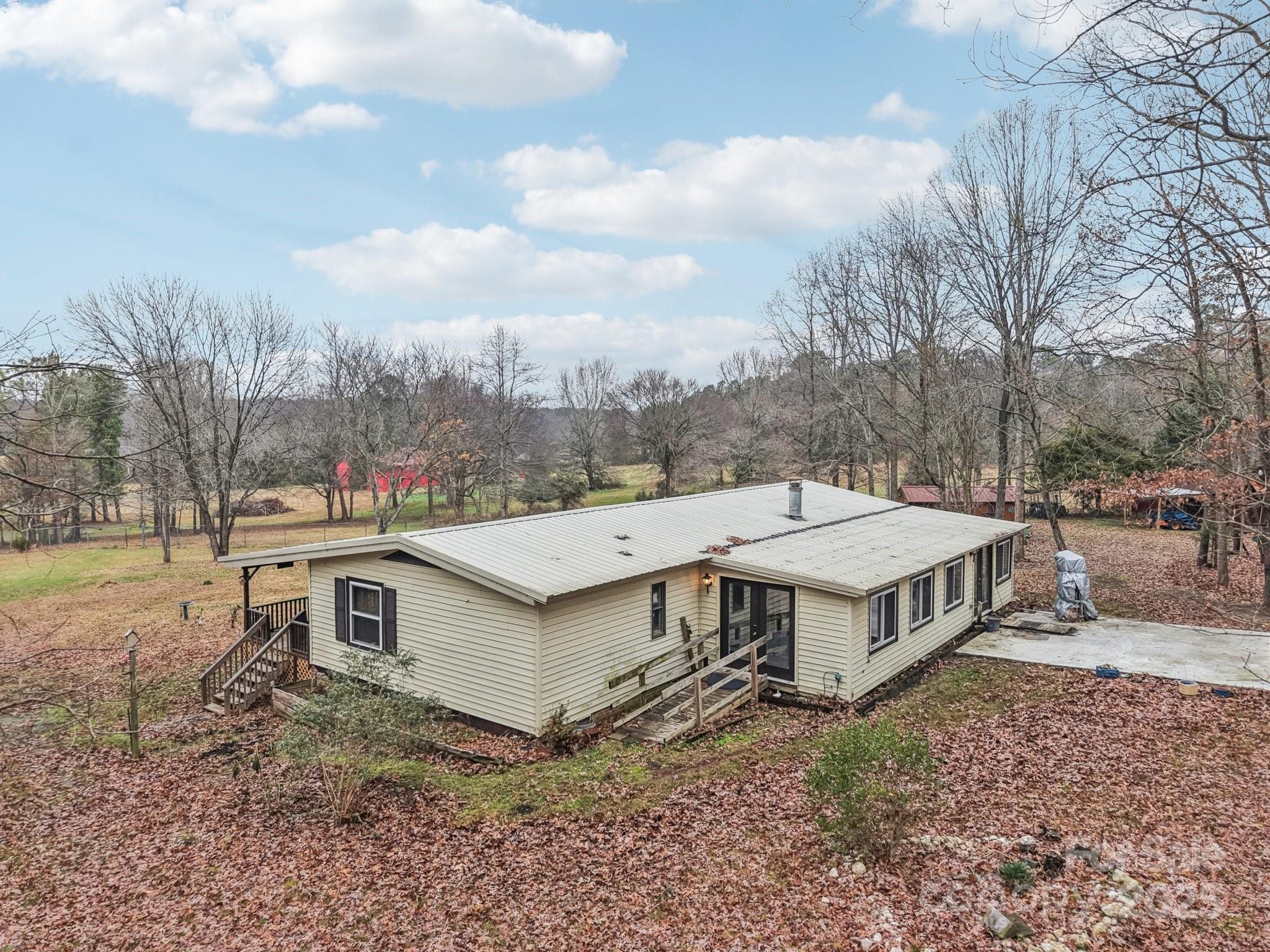 920 Dewitt Helms Road Monroe, NC 28112 - Photo 47 of 47 a view of a house with a yard and furniture