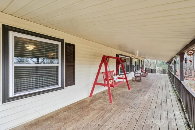 a view of balcony with wooden floor