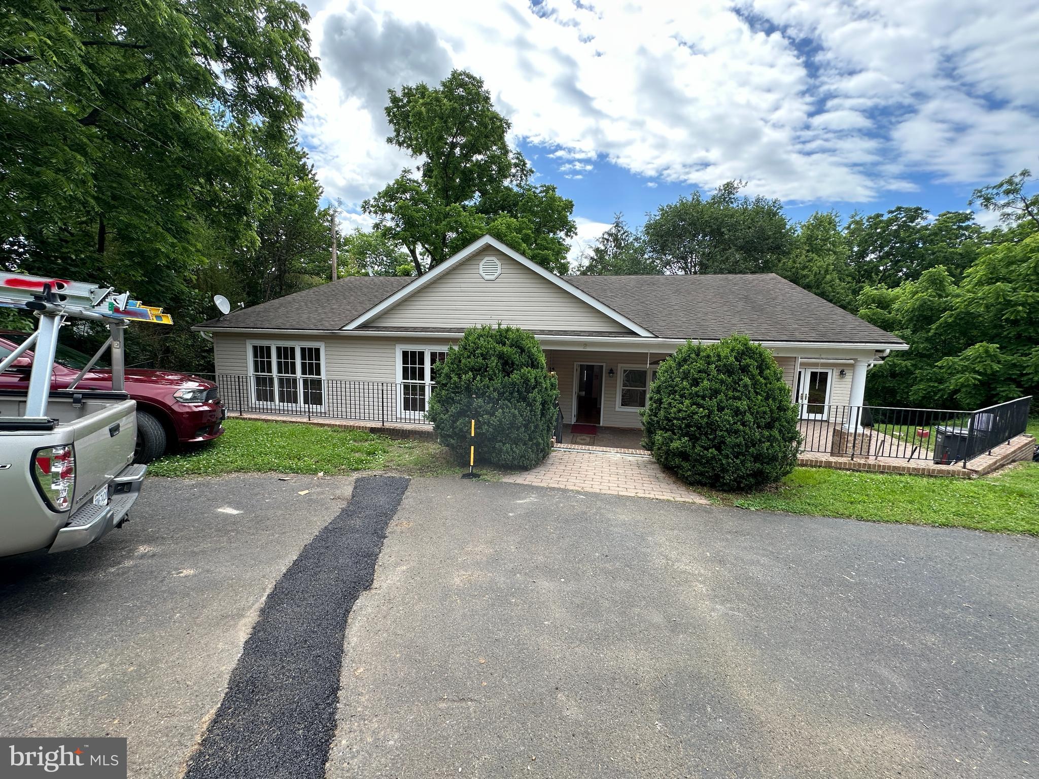 2 Whiting Avenue Boyce, VA 22620 - Photo 1 of 29 a front view of a house with a garden
