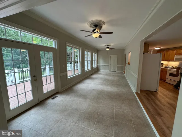 a view of a hallway with windows