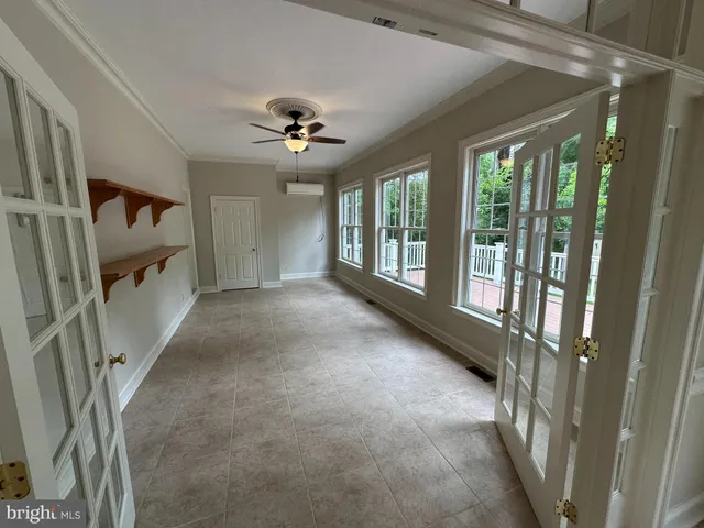 a view of entryway with stairs and a chandelier