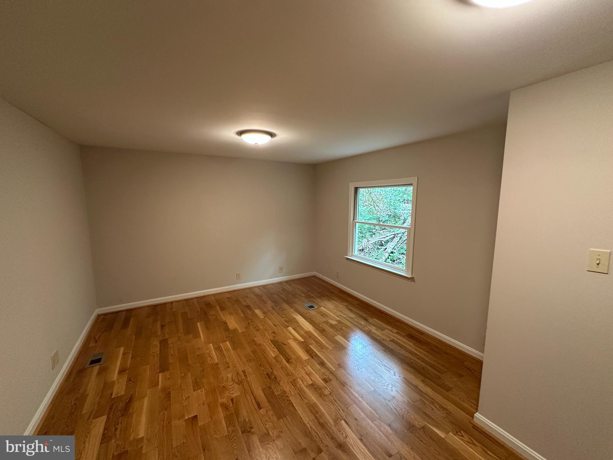 2 Whiting Avenue Boyce, VA 22620 - Photo 22 of 29 an empty room with wooden floor and windows