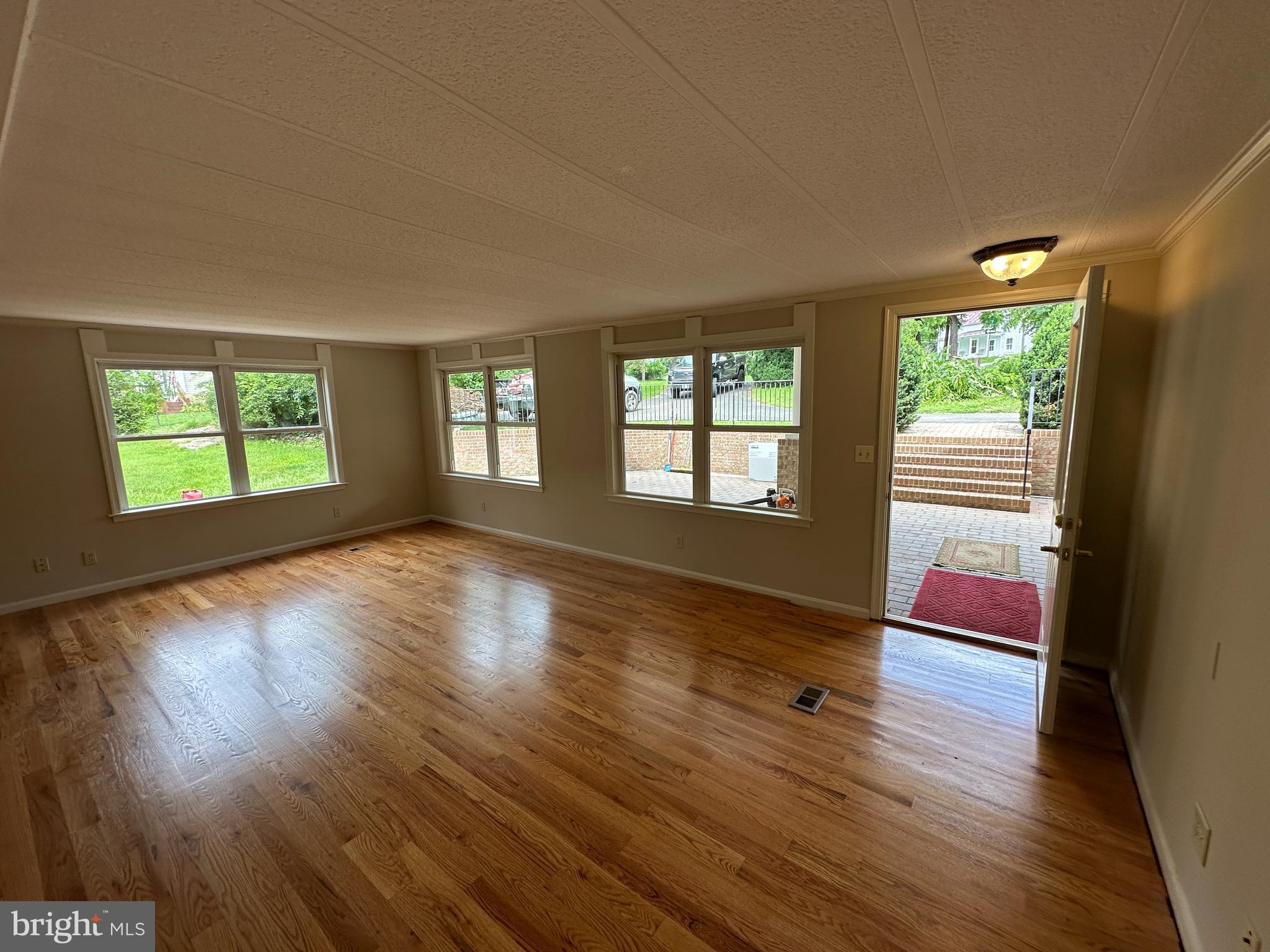 2 Whiting Avenue Boyce, VA 22620 - Photo 8 of 29 a view of an empty room with wooden floor and a window