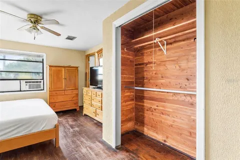 a view of walk in closet and bedroom