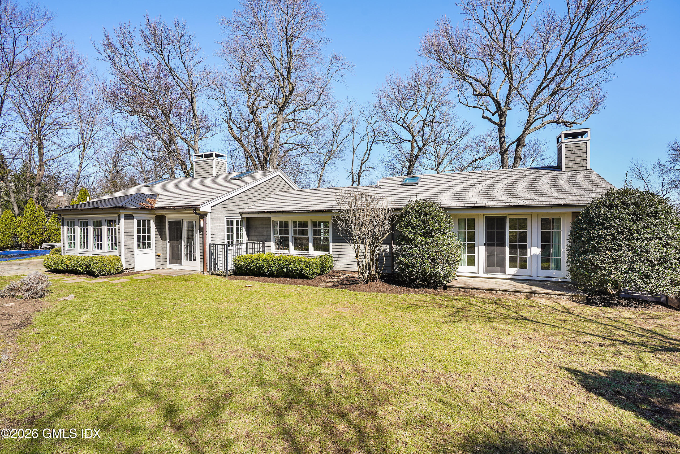 8 Willowmere Avenue Riverside, CT 06878 - Photo 48 of 50 a front view of a house with a yard