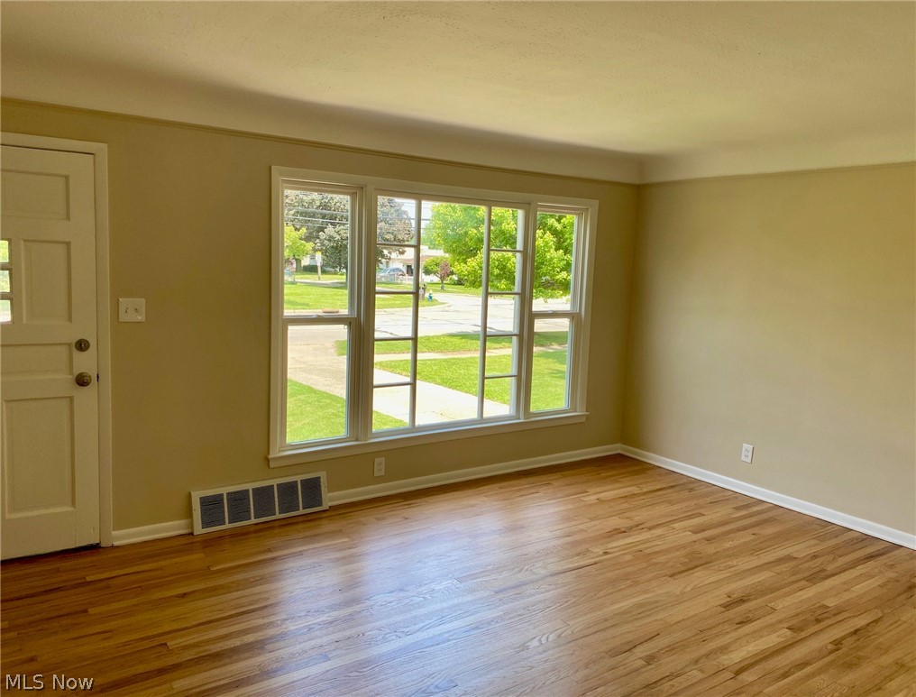 9605 Biddulph Road Cleveland, OH 44144 - Photo 9 of 24 Living room with refinished hardwood floor