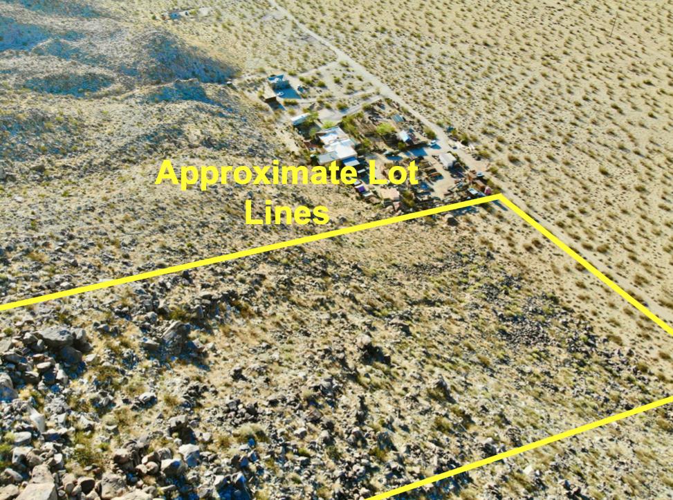 104 Sullivan Road Joshua Tree, CA 92252 - Photo 6 of 25 a view of a pathway to a wall