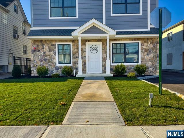 a front view of a house with garden