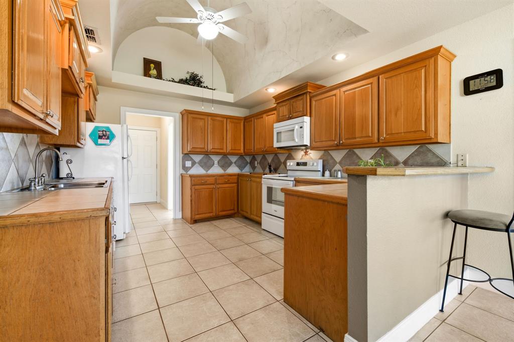 8718 Ranch Road Abilene, TX 79602 - Photo 23 of 40 Great counter space with newer appliances and new kitchen sink.