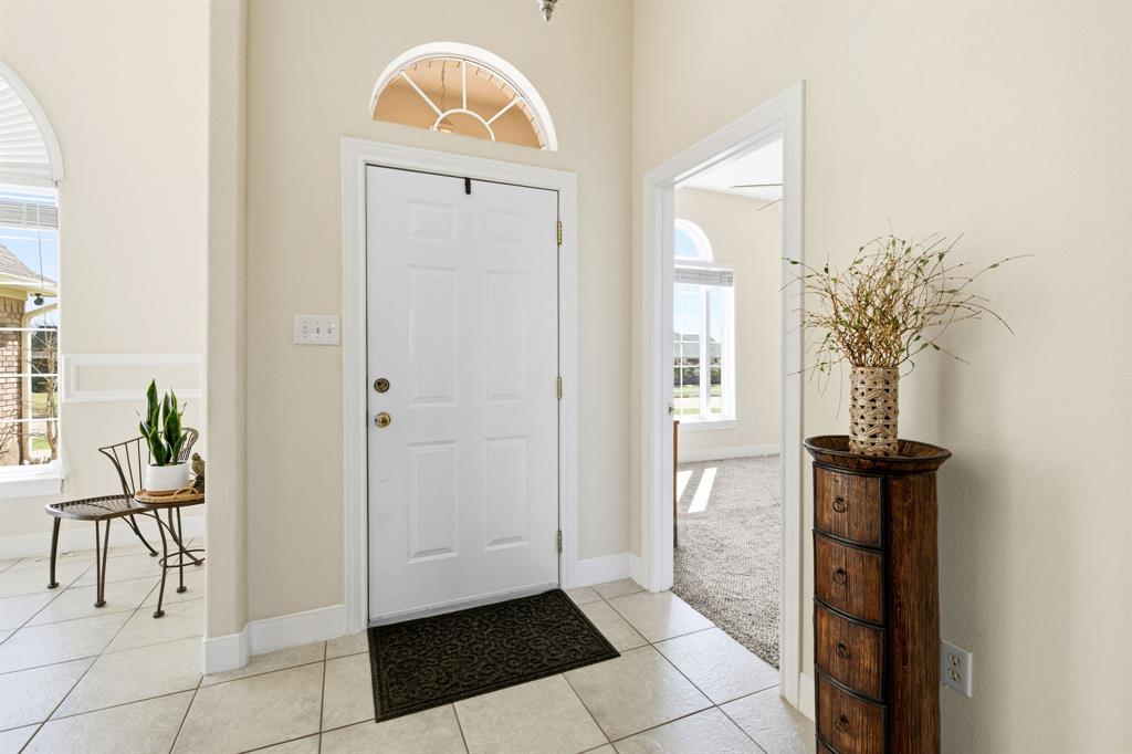 8718 Ranch Road Abilene, TX 79602 - Photo 6 of 40 Arched window above entry door and to the right is the designated office space.