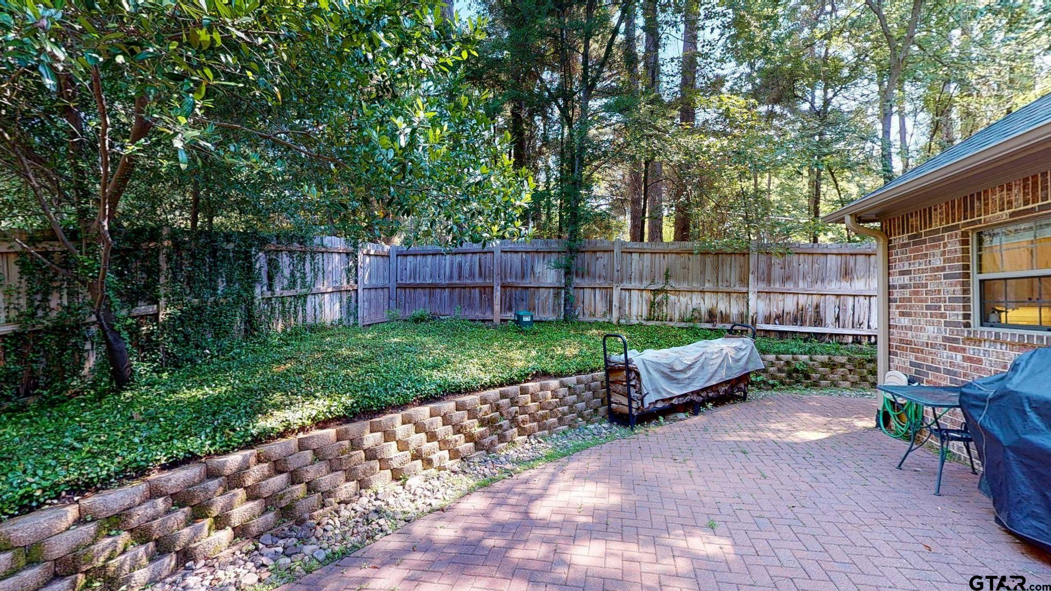 18488 Bluebird Circle Flint, TX 75762 - Photo 39 of 47 a garden with trees and a wooden fence