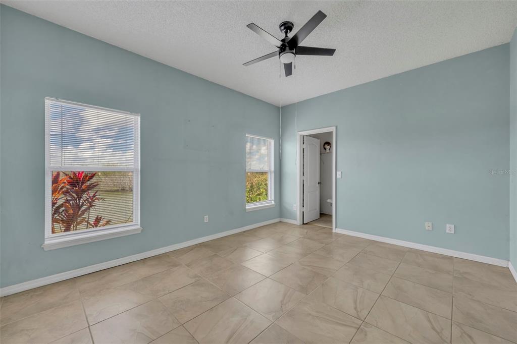 4718 Waterside Pointe Circle Orlando, FL 32829 - Photo 15 of 30 a view of an empty room with a window