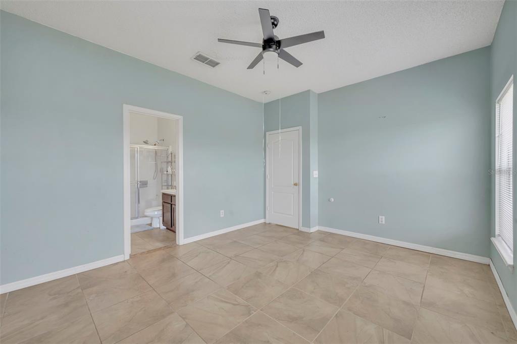 4718 Waterside Pointe Circle Orlando, FL 32829 - Photo 16 of 30 wooden floor in an empty room