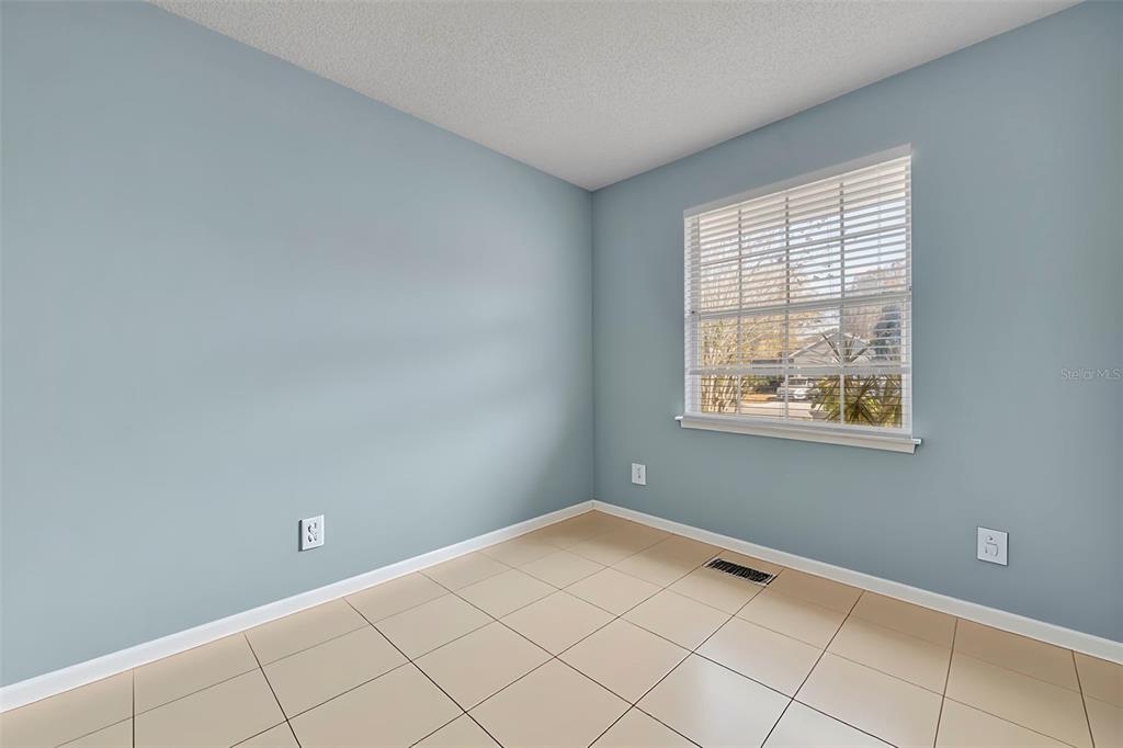 4718 Waterside Pointe Circle Orlando, FL 32829 - Photo 18 of 30 a view of an empty room with a window