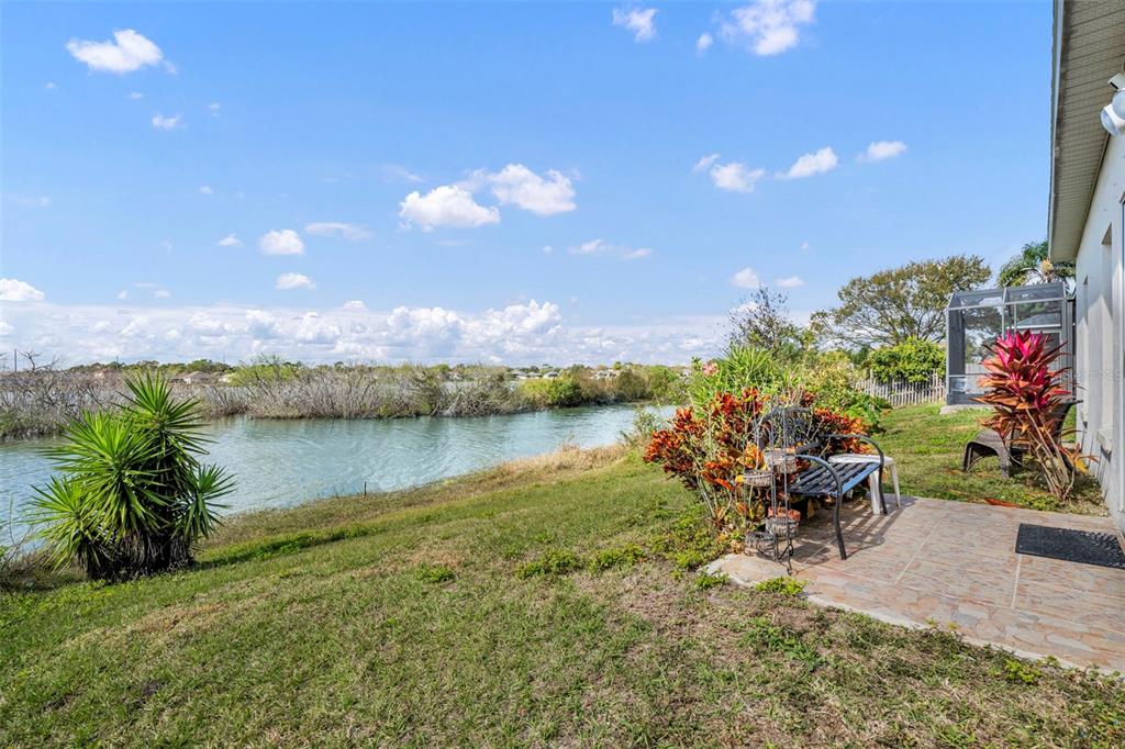 4718 Waterside Pointe Circle Orlando, FL 32829 - Photo 21 of 30 a view of a lake with sitting area