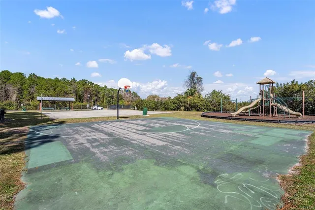 a view of outdoor space with playground and green space