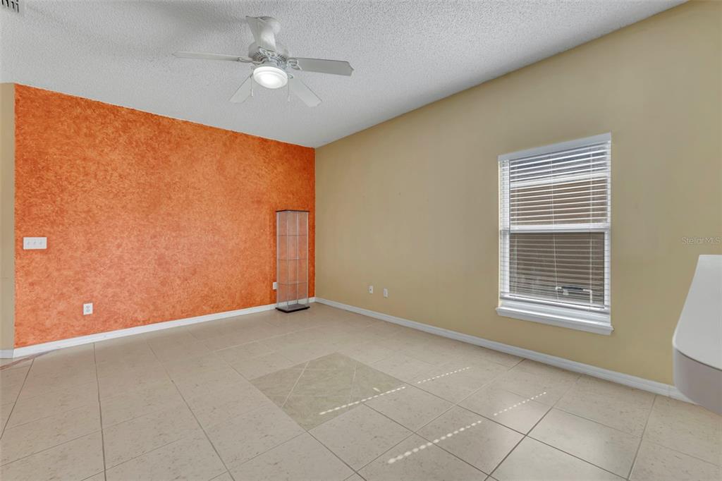 4718 Waterside Pointe Circle Orlando, FL 32829 - Photo 9 of 30 a view of an empty room with a window