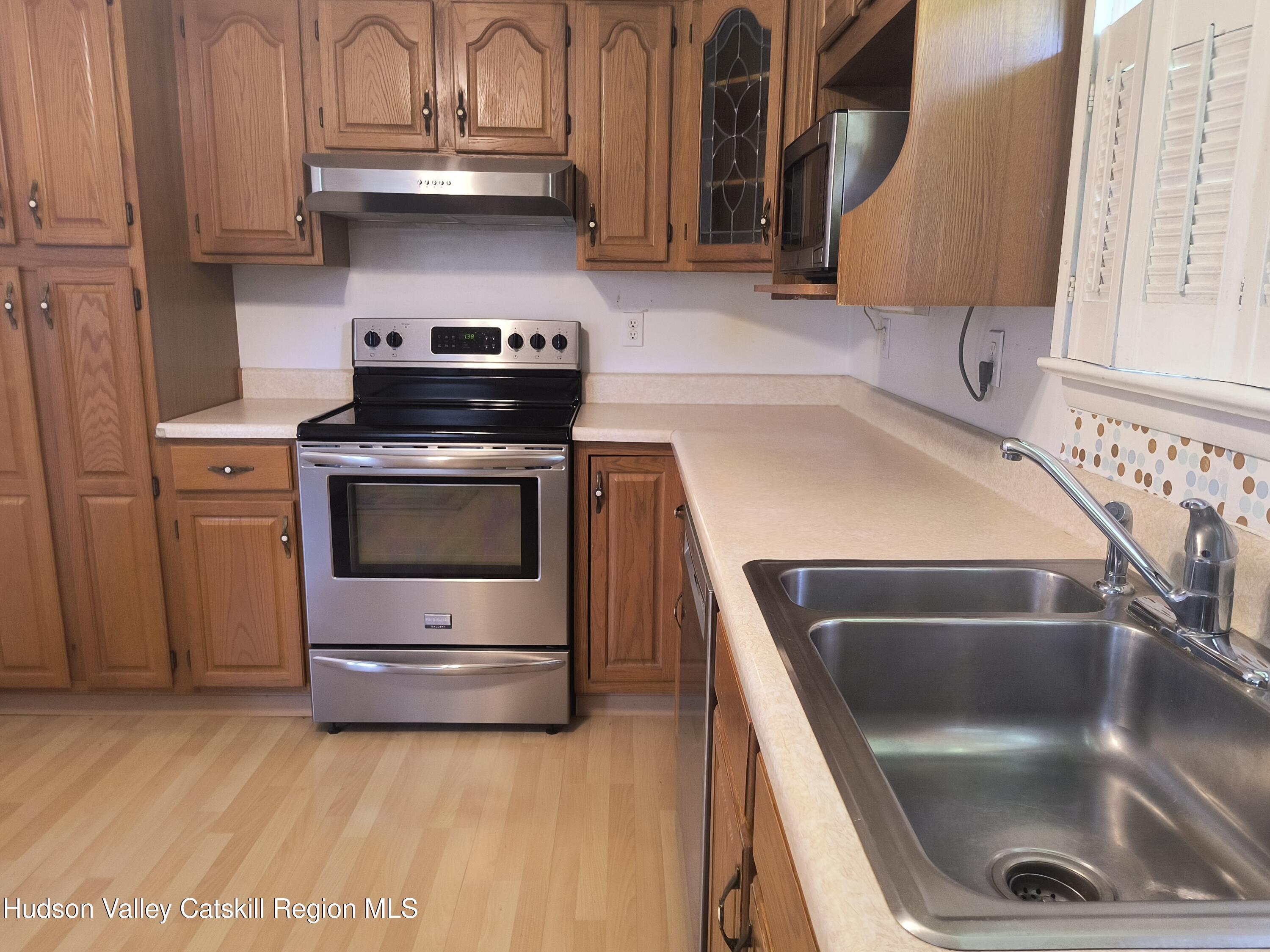 14 Strawberry Hill Road Poughkeepsie, NY 12601 - Photo 11 of 48 a kitchen with a sink and a stove top oven