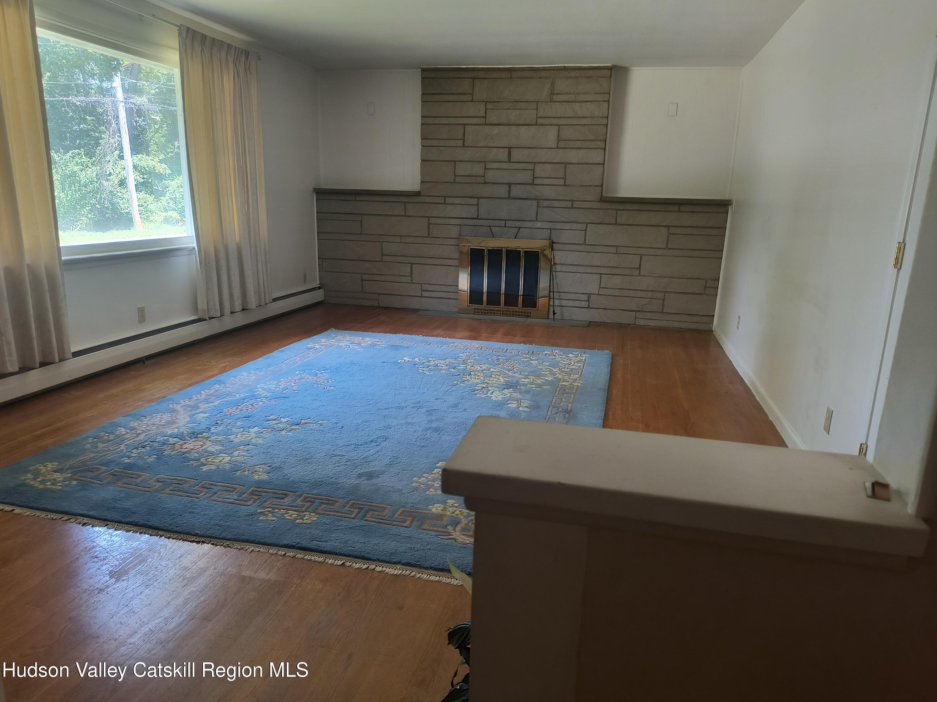 14 Strawberry Hill Road Poughkeepsie, NY 12601 - Photo 14 of 48 a view of empty room with fireplace and window