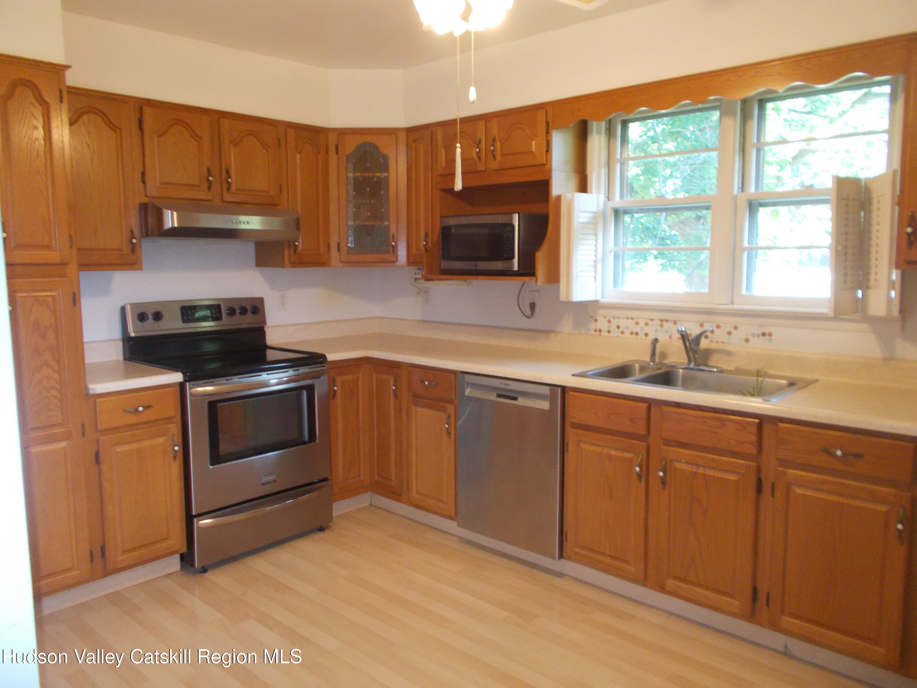 14 Strawberry Hill Road Poughkeepsie, NY 12601 - Photo 21 of 48 a kitchen with a sink cabinets and window