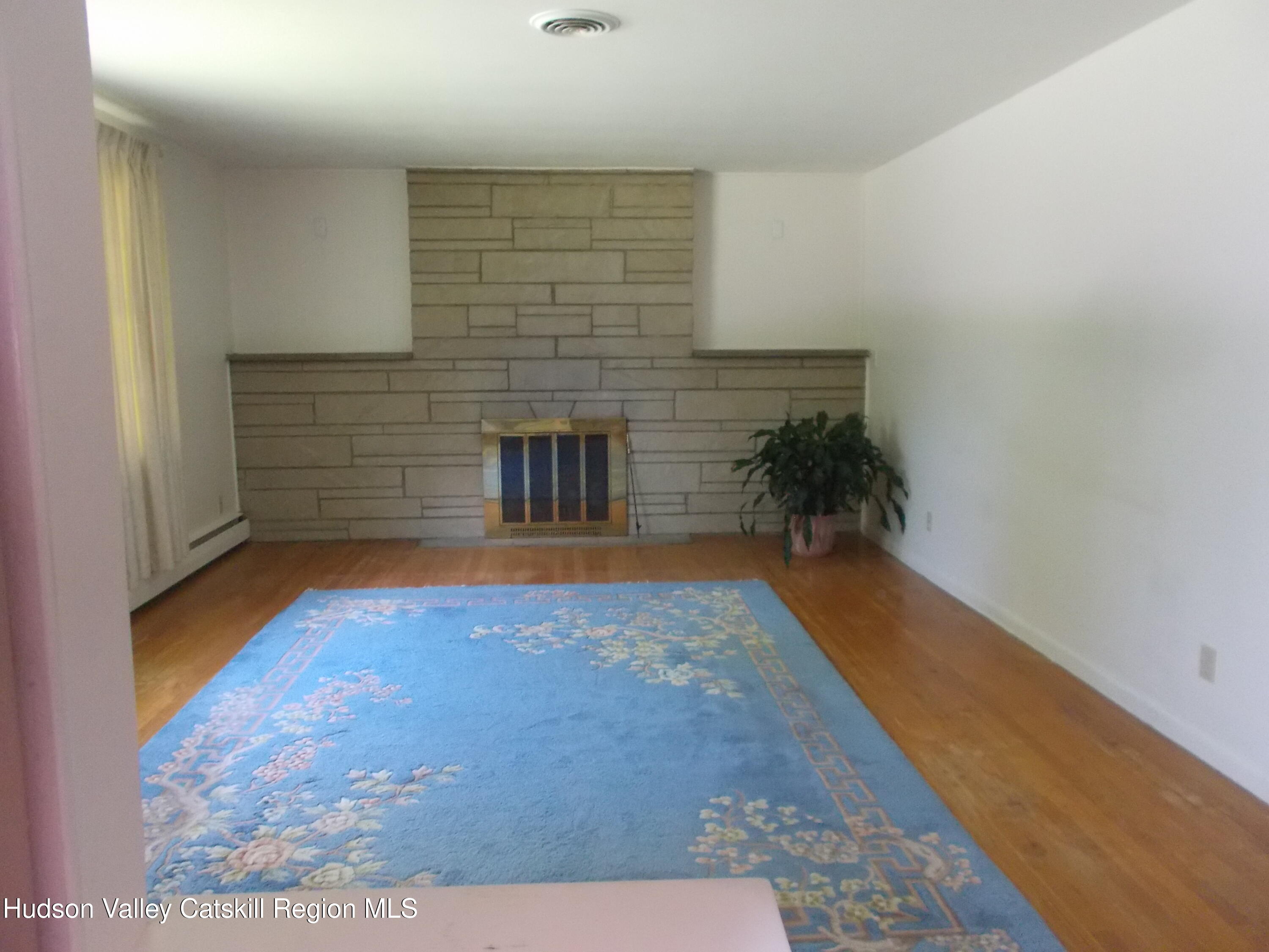14 Strawberry Hill Road Poughkeepsie, NY 12601 - Photo 24 of 48 a view of empty room with a fireplace