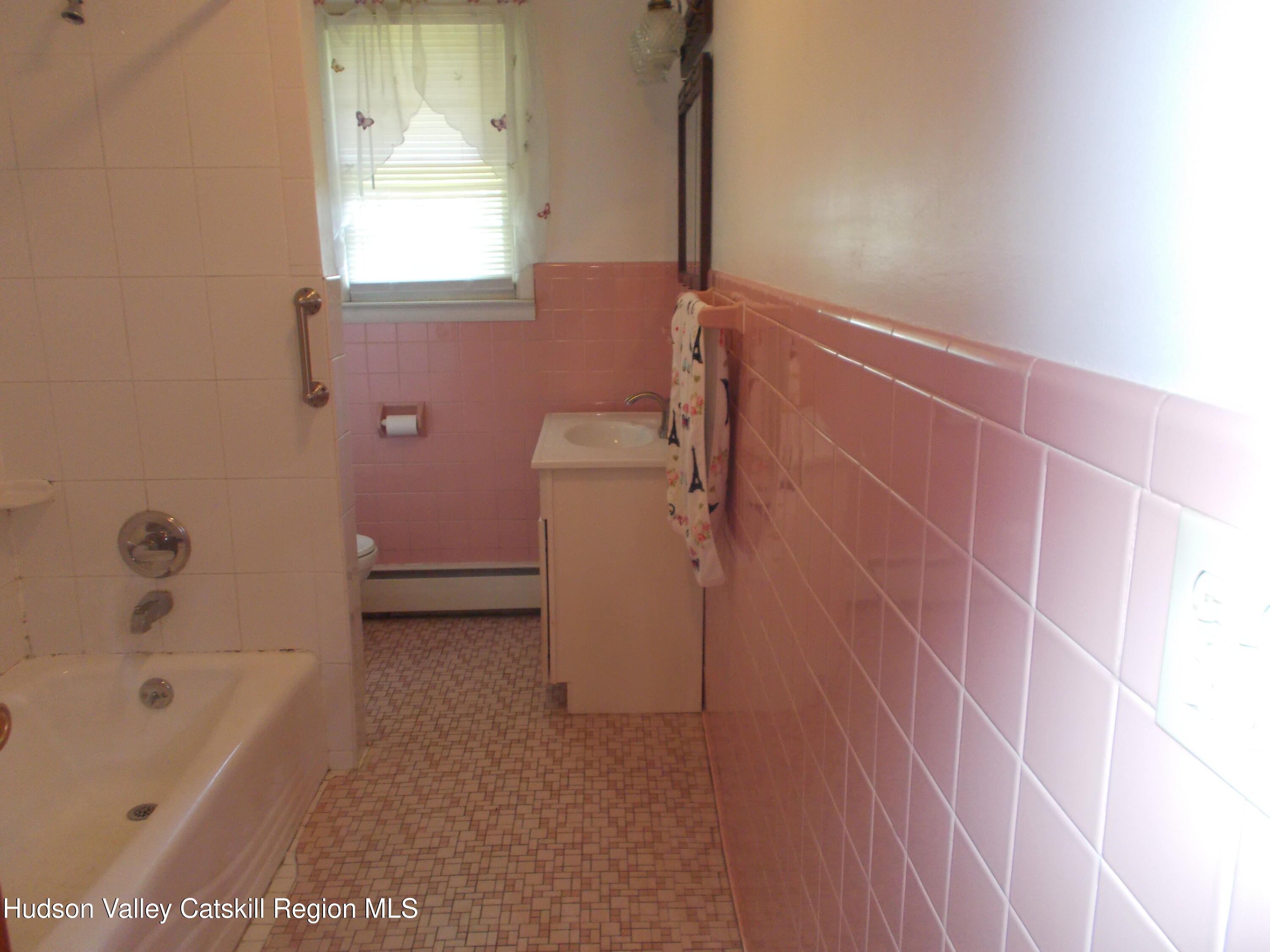14 Strawberry Hill Road Poughkeepsie, NY 12601 - Photo 29 of 48 a bathroom with a bathtub a toilet and a shower