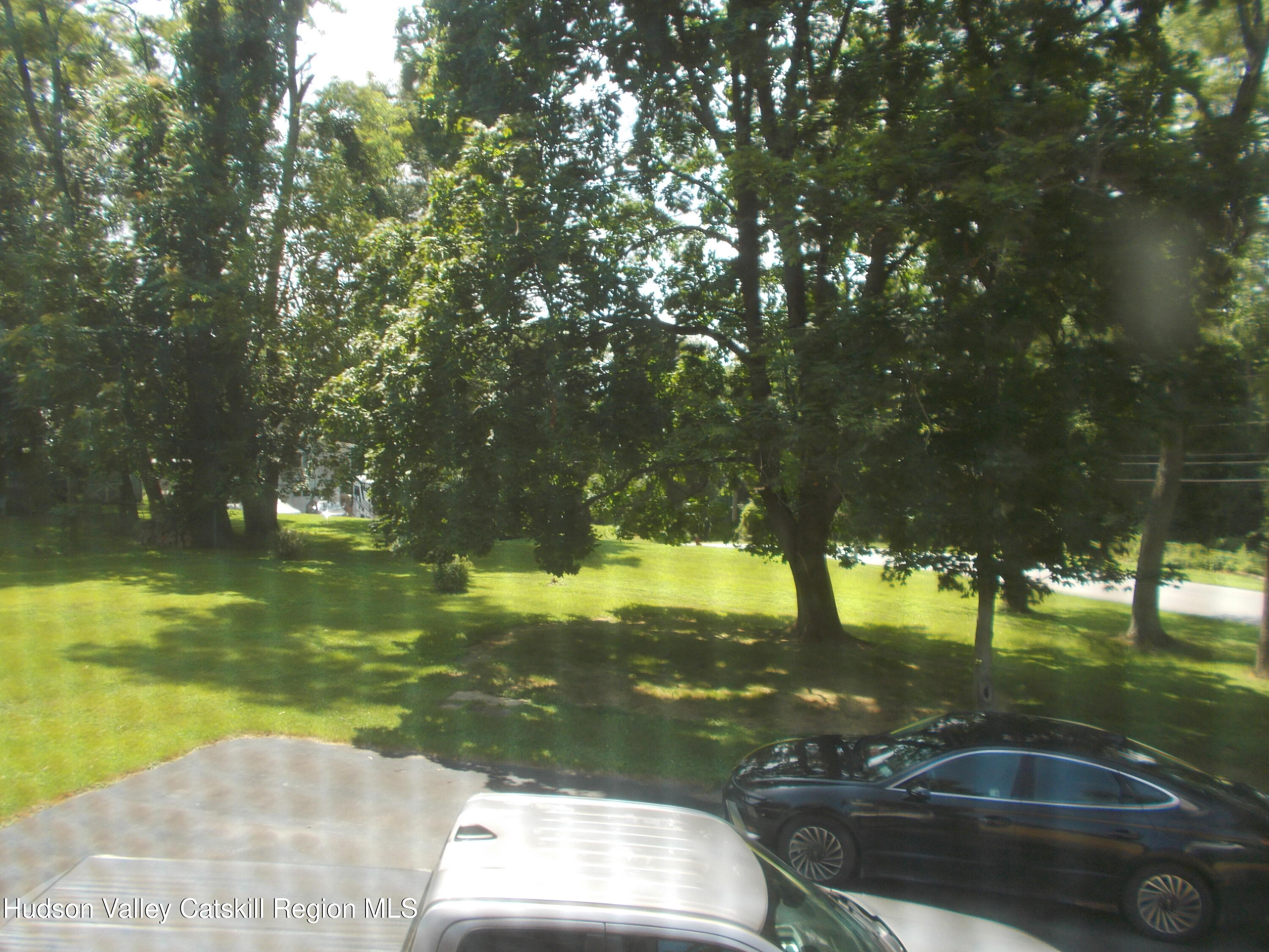 14 Strawberry Hill Road Poughkeepsie, NY 12601 - Photo 36 of 48 a backyard of a house with table and chairs