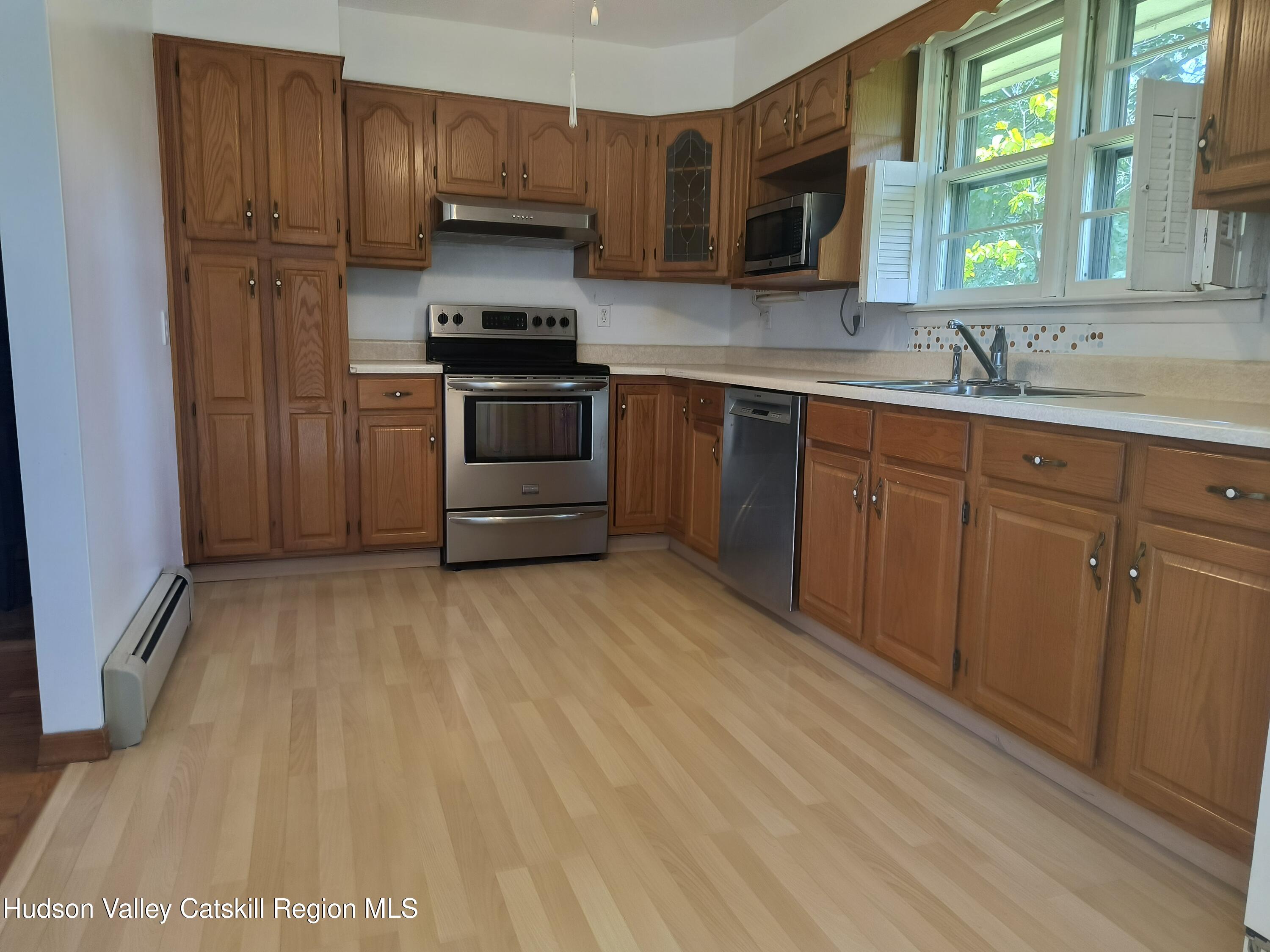 14 Strawberry Hill Road Poughkeepsie, NY 12601 - Photo 10 of 48 a kitchen with stainless steel appliances granite countertop a stove a sink and a microwave