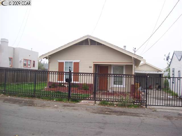 28 Madison Avenue Bay Point, CA 94565 - Photo 1 of 1 a view of a small yard and wooden fence