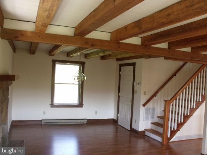 7037 Olinger Road Marshall, VA 20115 - Photo 9 of 30 a view of empty room with wooden floor and fan