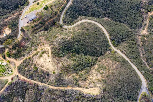 a view of mountain with sunset in background