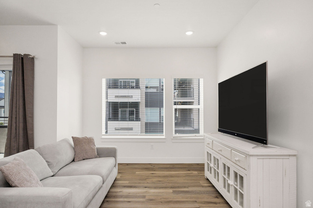 3115 South 200 West, Unit C201 Nibley, UT 84321 - Photo 2 of 23 Living area featuring wood-finish flooring, recessed lighting, and white walls