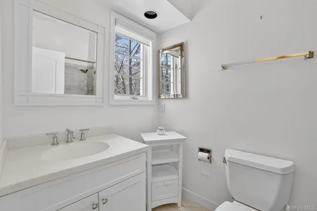 a bathroom with a shower and a bath tub
