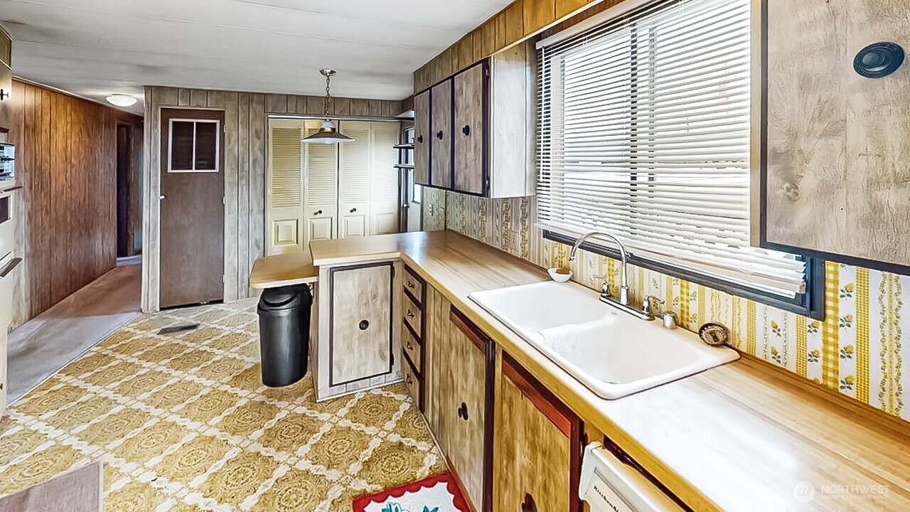 11453 Bayview Edison Road, Unit 25 Mount Vernon, WA 98273 - Photo 8 of 20 a bathroom with a sink a mirror and shower