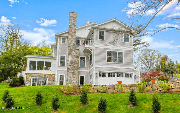 6 Perkley Lane Riverside, CT 06878 - Photo 1 of 52 a front view of a house with a yard