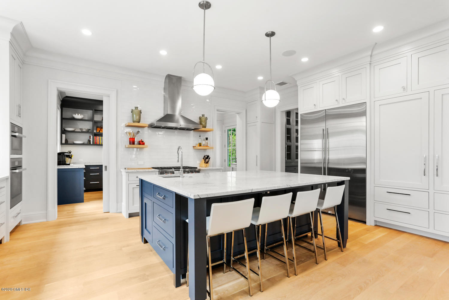 6 Perkley Lane Riverside, CT 06878 - Photo 13 of 52 a kitchen with kitchen island a stove a table and chairs in it