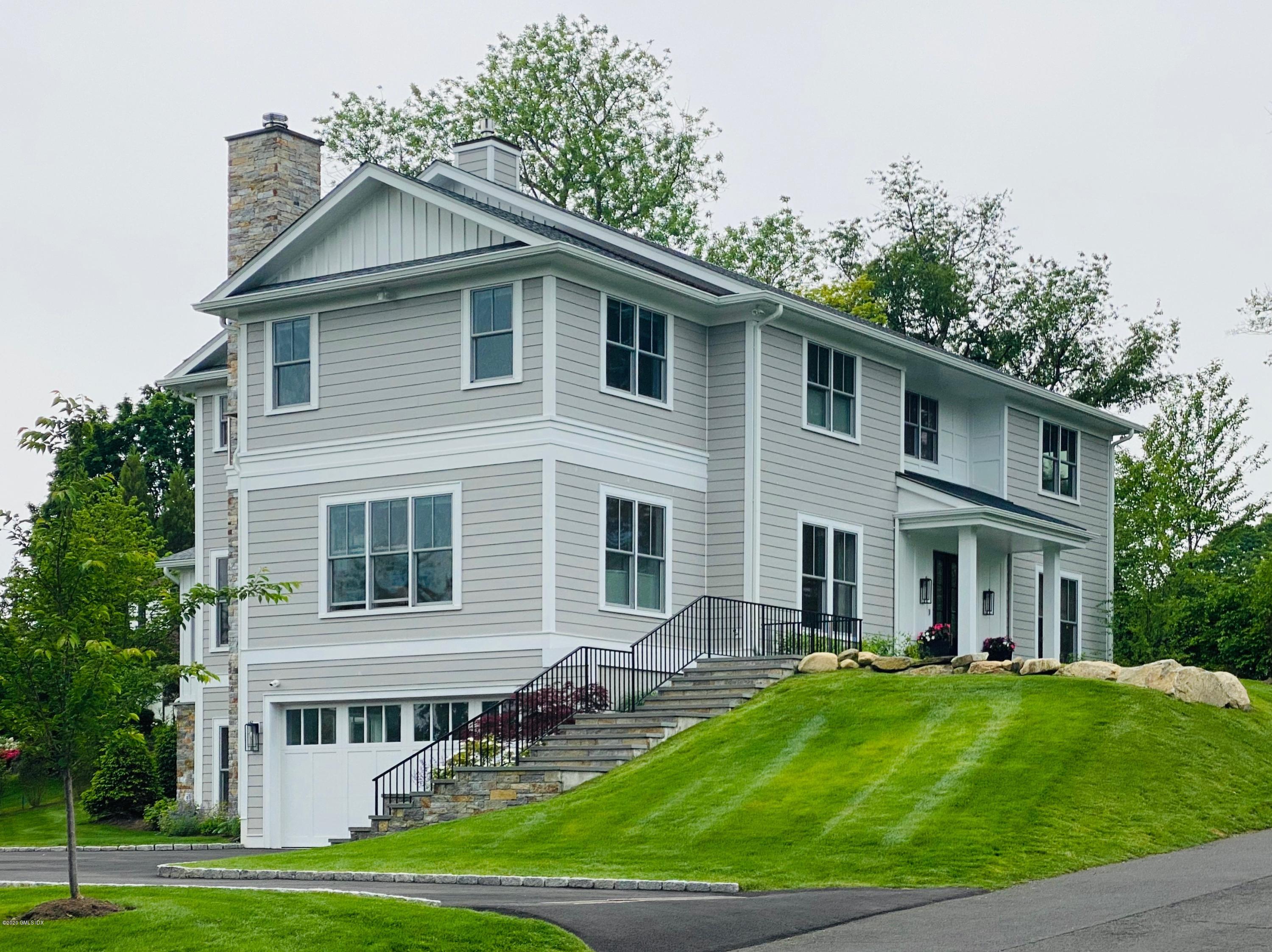 6 Perkley Lane Riverside, CT 06878 - Photo 2 of 52 a front view of a house with a yard