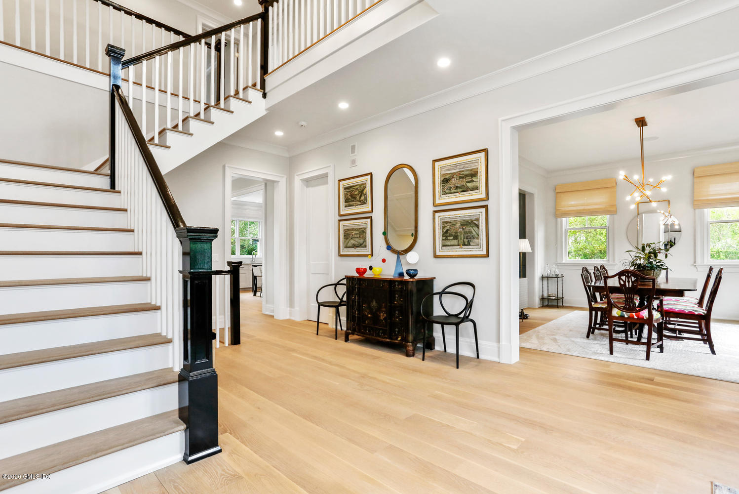 6 Perkley Lane Riverside, CT 06878 - Photo 21 of 52 a view of a livingroom with furniture stairs wooden floor and windows