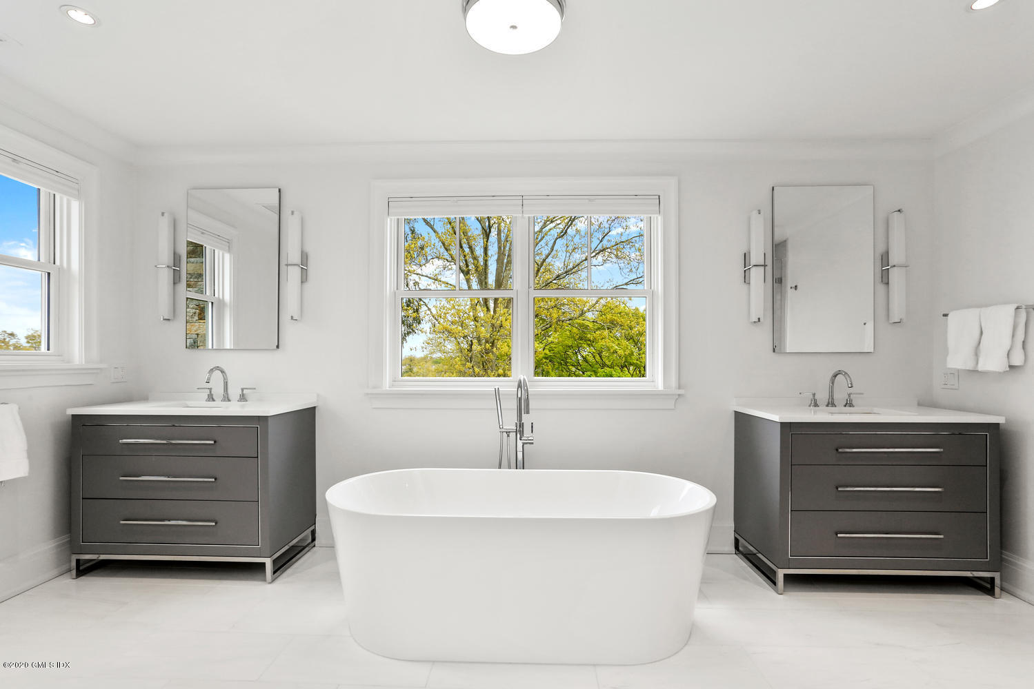 6 Perkley Lane Riverside, CT 06878 - Photo 28 of 52 a bathroom with a tub a sink and a window