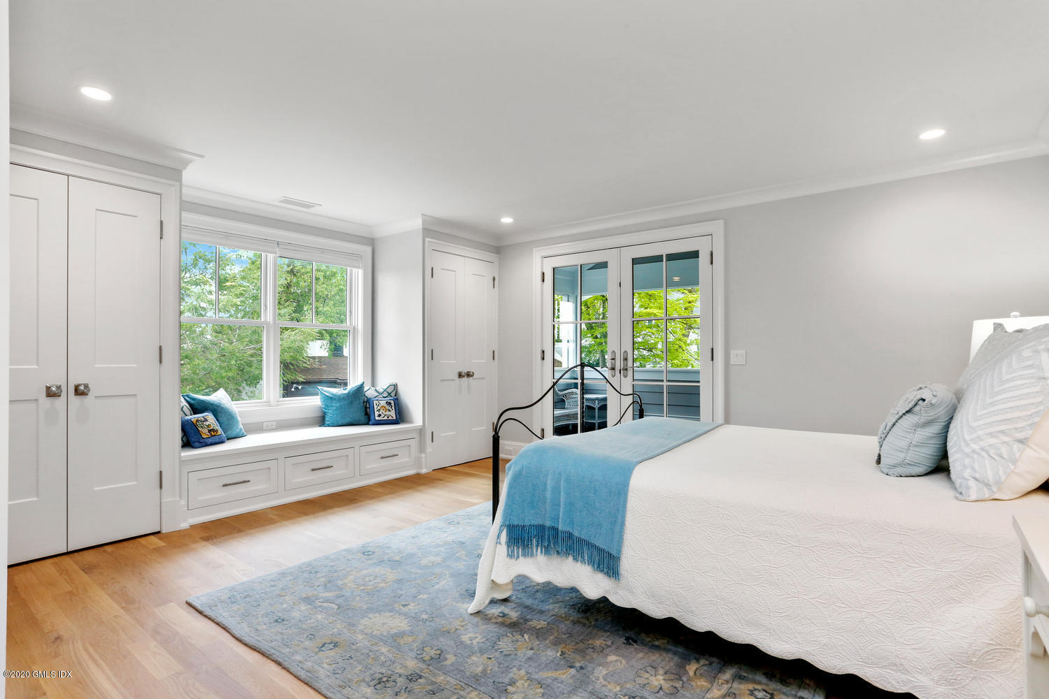 6 Perkley Lane Riverside, CT 06878 - Photo 36 of 52 a bedroom with a bed and glass window