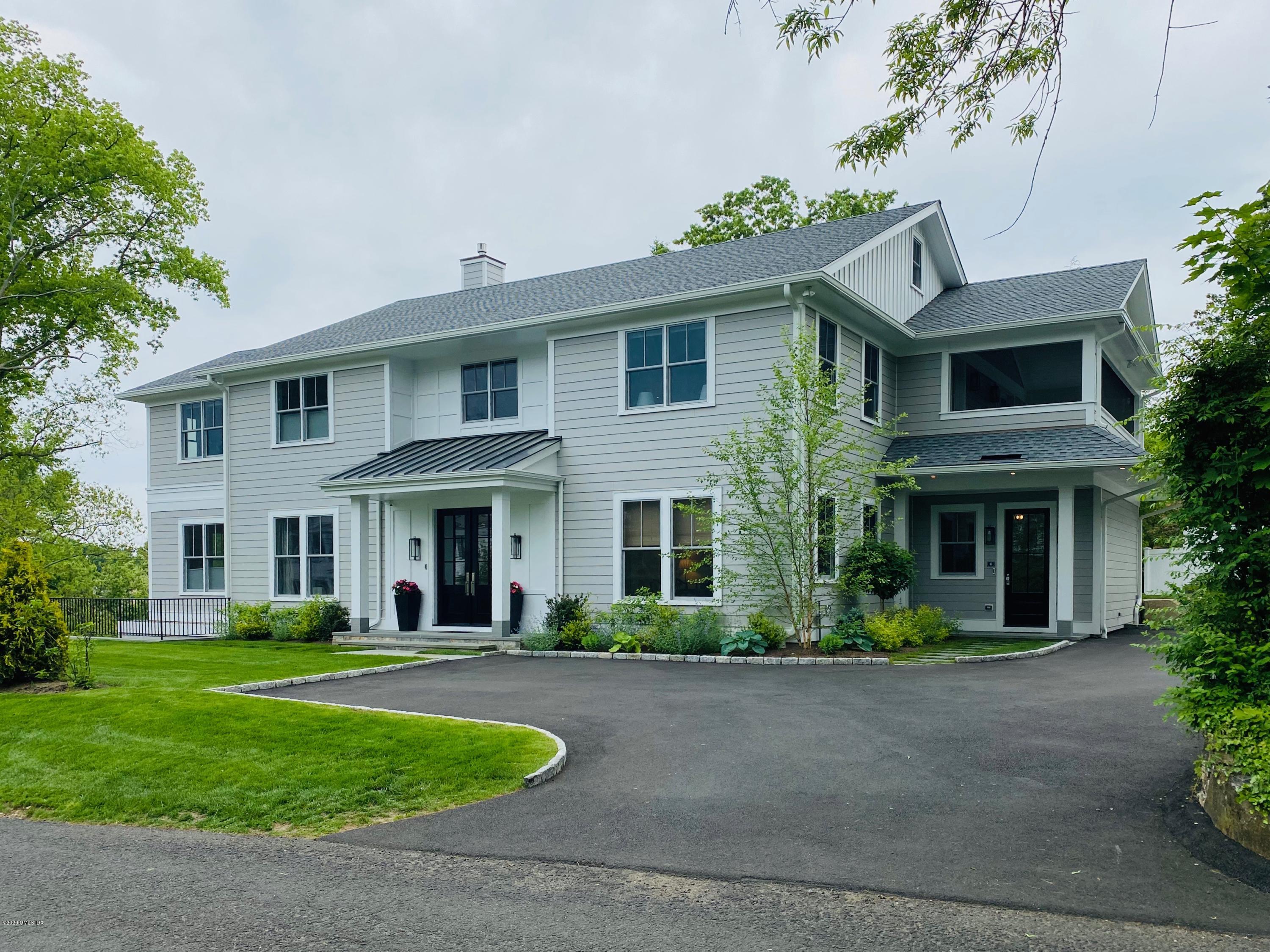 6 Perkley Lane Riverside, CT 06878 - Photo 4 of 52 a front view of a house with a yard