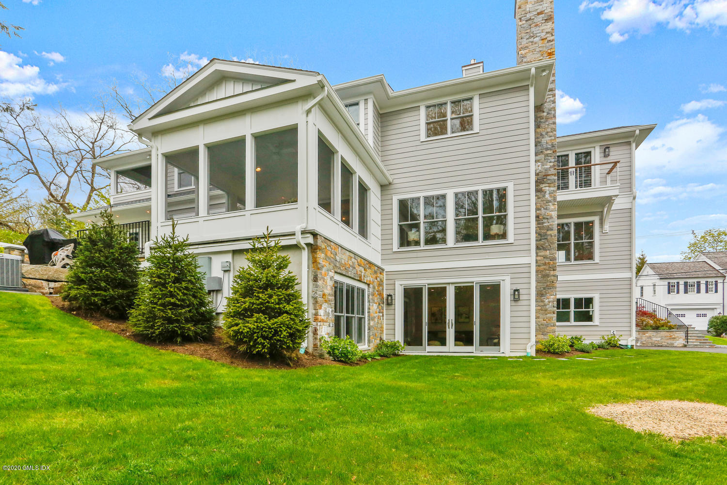 6 Perkley Lane Riverside, CT 06878 - Photo 45 of 52 a front view of a house with a garden