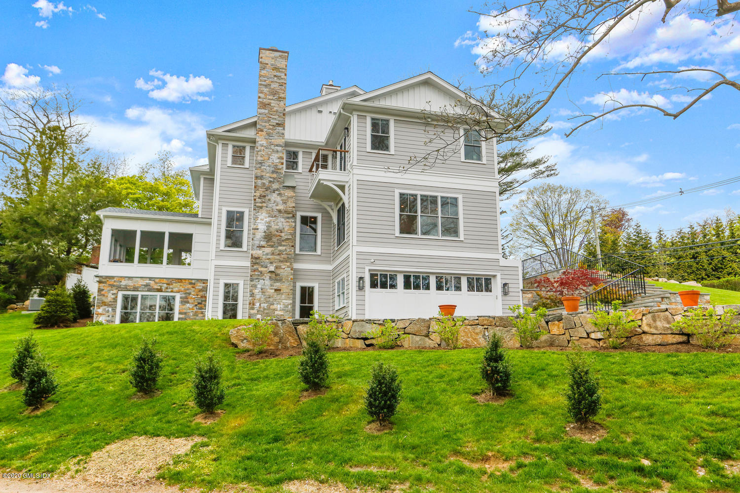 6 Perkley Lane Riverside, CT 06878 - Photo 46 of 52 a front view of a house with a yard