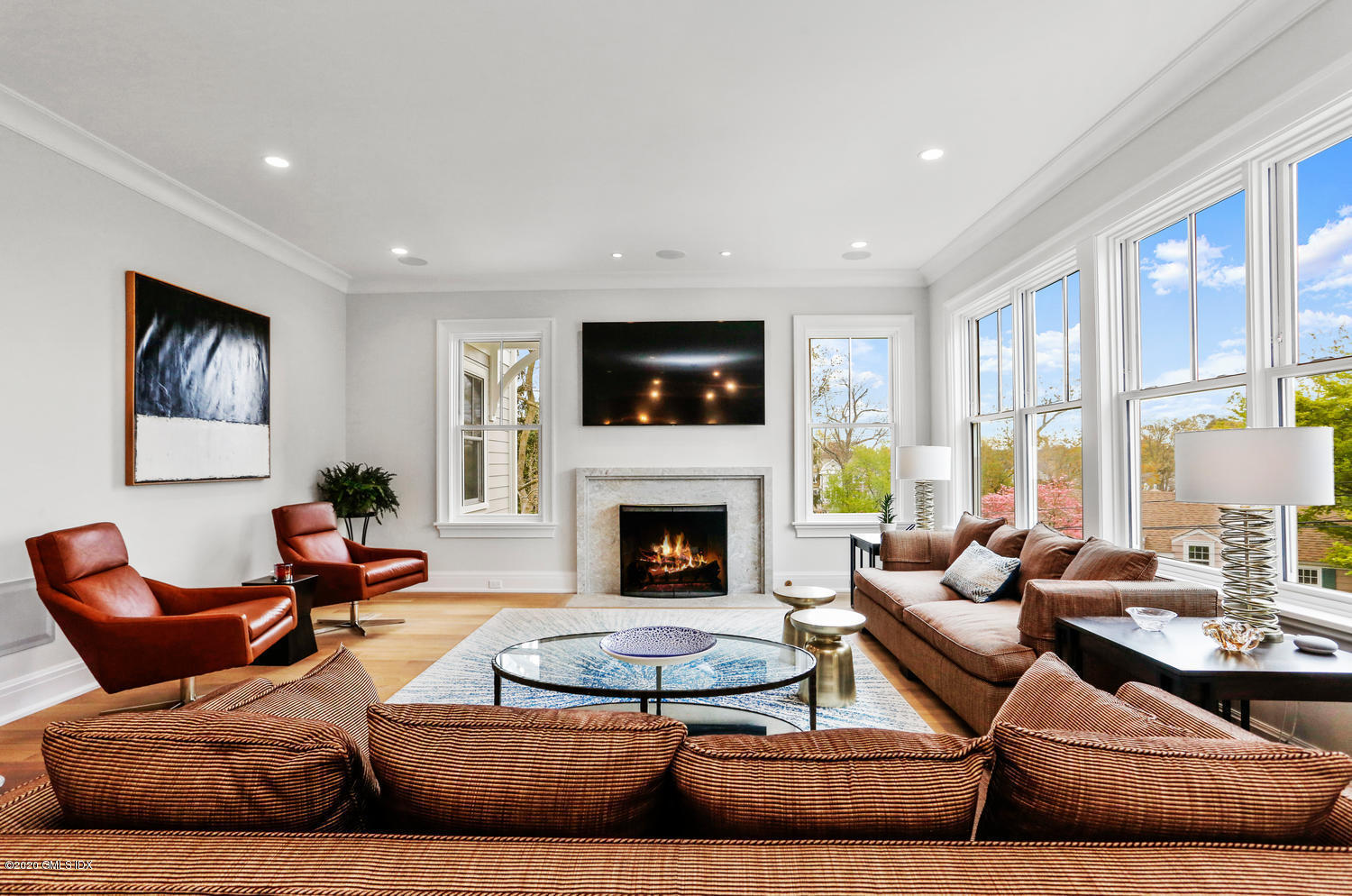 6 Perkley Lane Riverside, CT 06878 - Photo 8 of 52 a living room with furniture fireplace and flat screen tv
