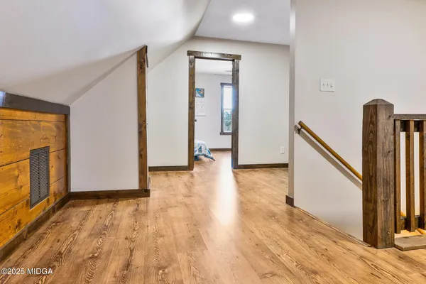 a view of entryway and hall with dining room