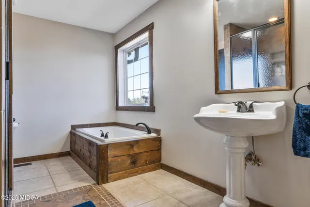 a living room with furniture a fireplace and shelf