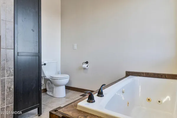 a big yard with lots of green space and plants