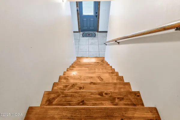 a view of a house with a yard and garage